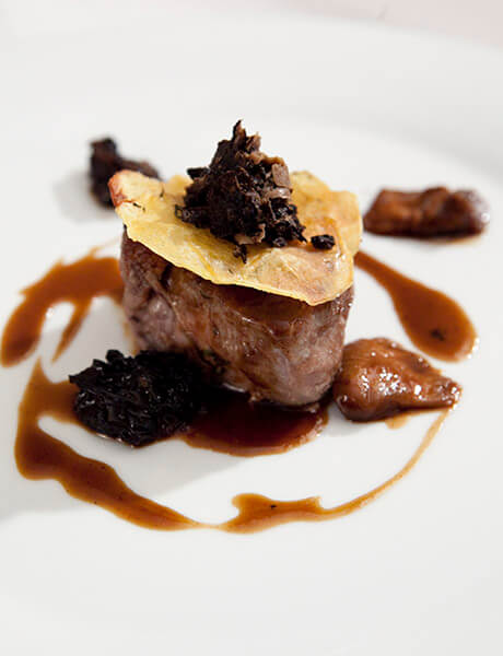 veal fillet, porcini jus, black truffle, potato anna by chef kostas arampatzis